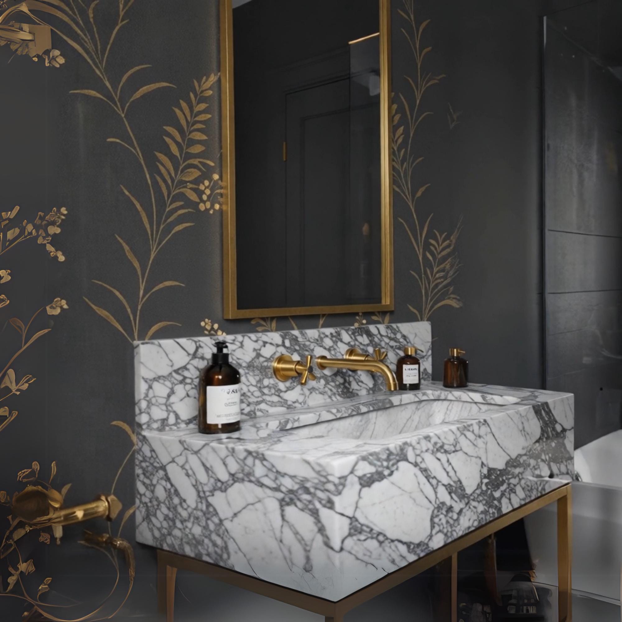 An Arabescato marble console sink elevated on a brass stand, offering a timeless and architectural bathroom statement.

