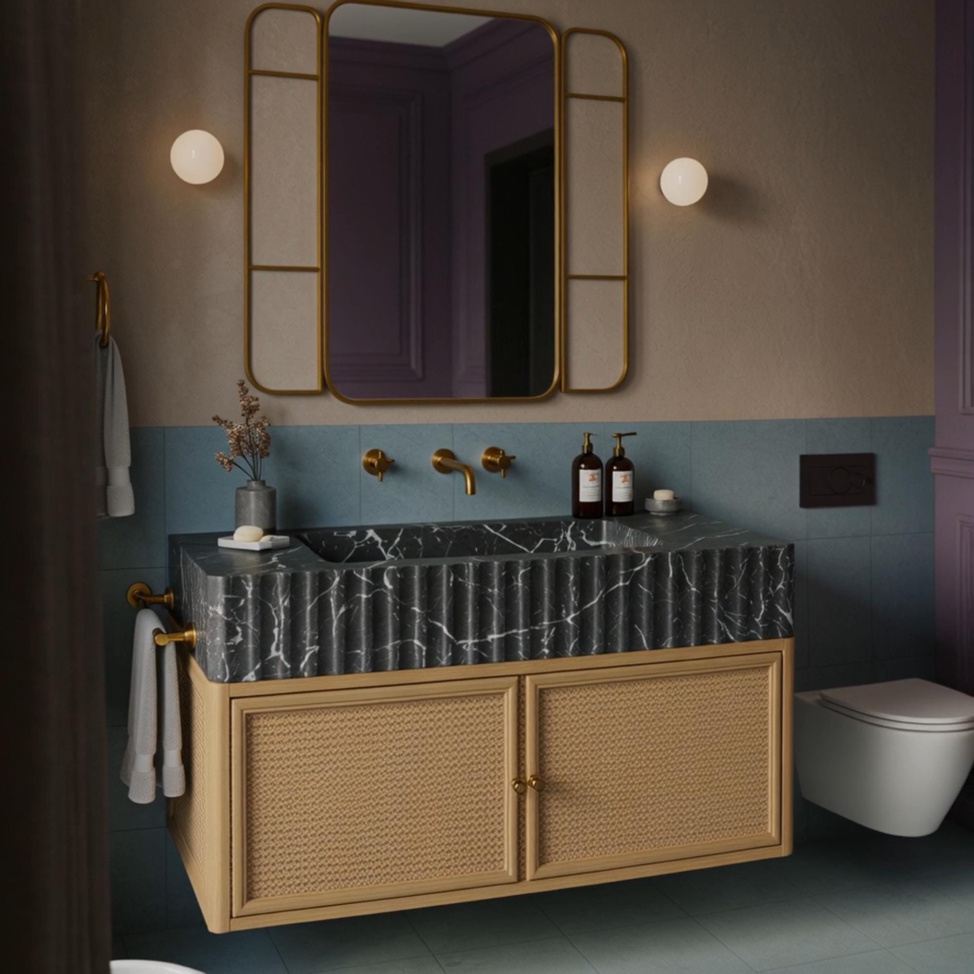 This floating vanity combines black fluted marble and natural rattan for a warm, textural contrast in upscale interiors.
