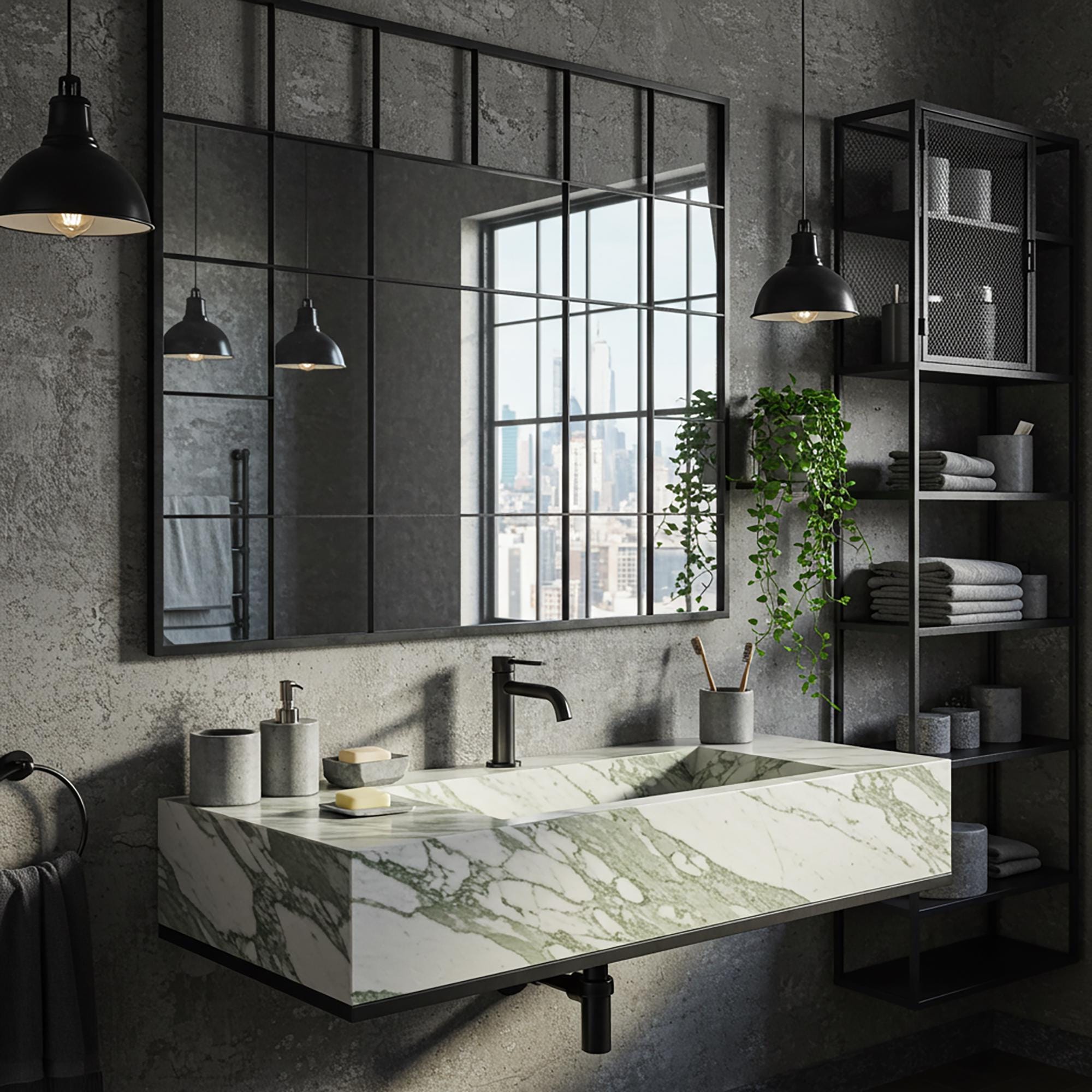 A Calacatta Green marble floating vanity with soft green veining, paired with matte black fixtures and detailing in a modern, industrial-style bathroom.
