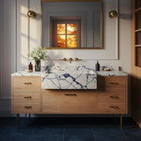 A Calacatta Viola marble farmhouse vanity with an apron-front sink, featuring bold veining and a natural oak cabinet with brass hardware.

