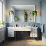 A Carrara marble clad double pedestal console with soft gray veining, featuring brass legs and integrated drawers in a bright, elegant bathroom.
