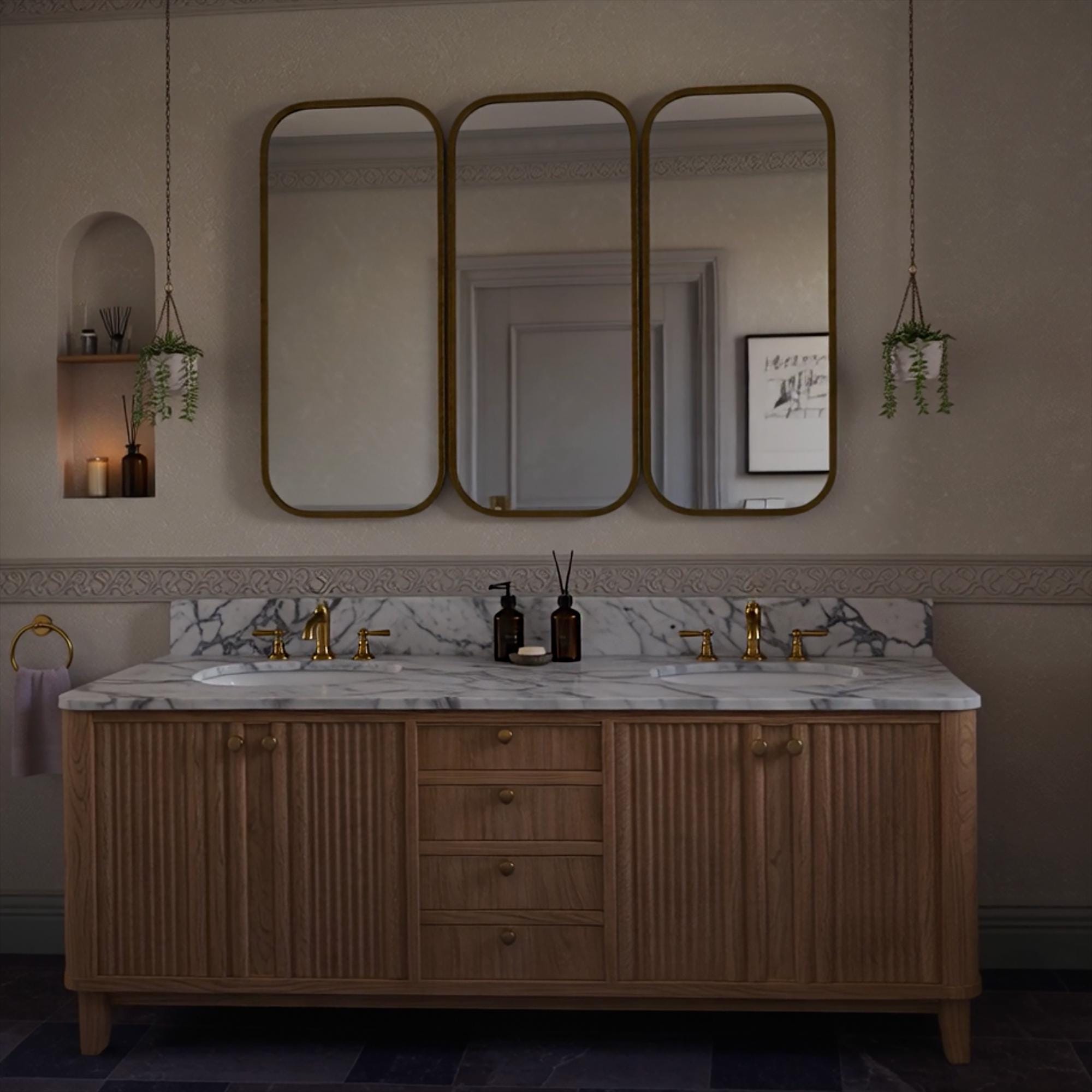 A Carrara marble double sink vanity styled with fluted oak cabinets and warm brass accents in a calm, well-appointed bathroom.
