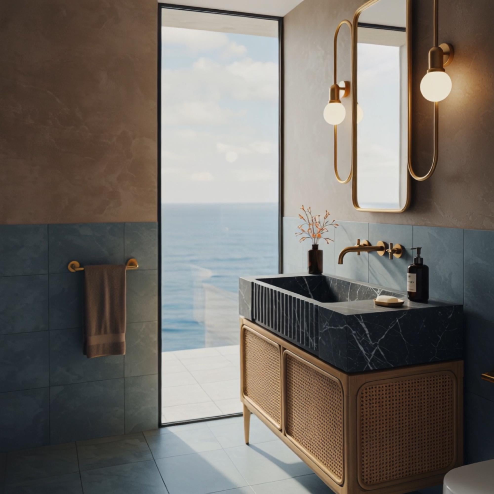 A fluted black marble vanity sitting on a rattan wood base brings modern organic sophistication to luxury interiors.