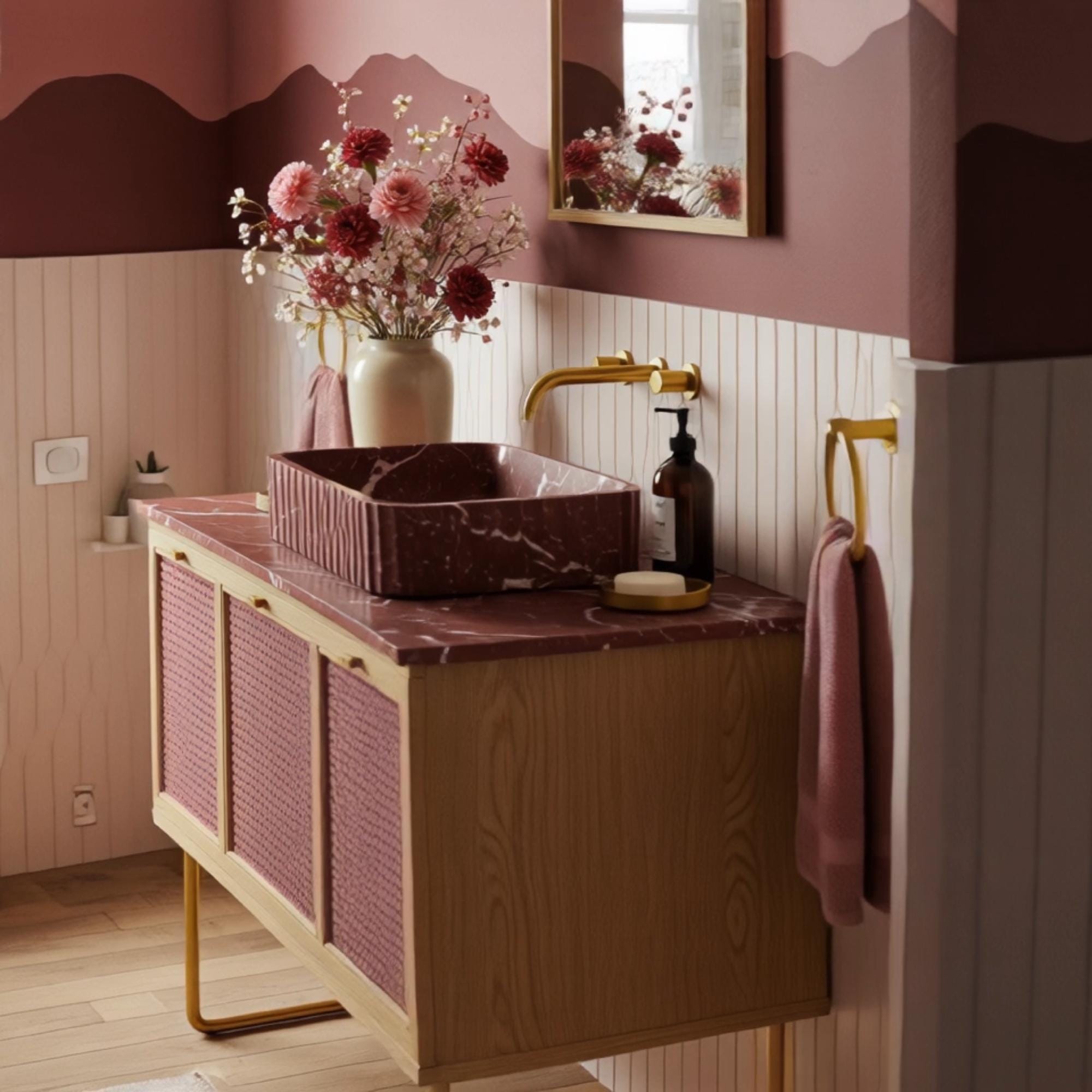 A bohemian-inspired marble vanity with a fluted red stone basin, combined with warm wood cabinetry and rattan panels in an elegant interior.
