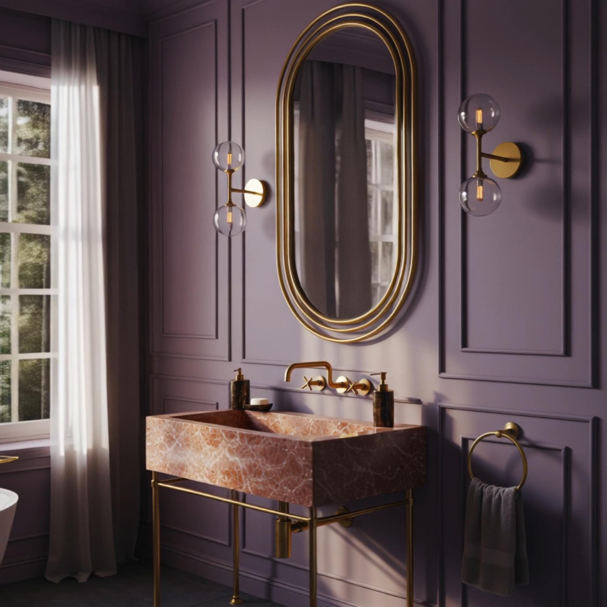 This luxury bathroom sink pairs Rosa Tea marble with warm brass accents for a refined, upscale finish.