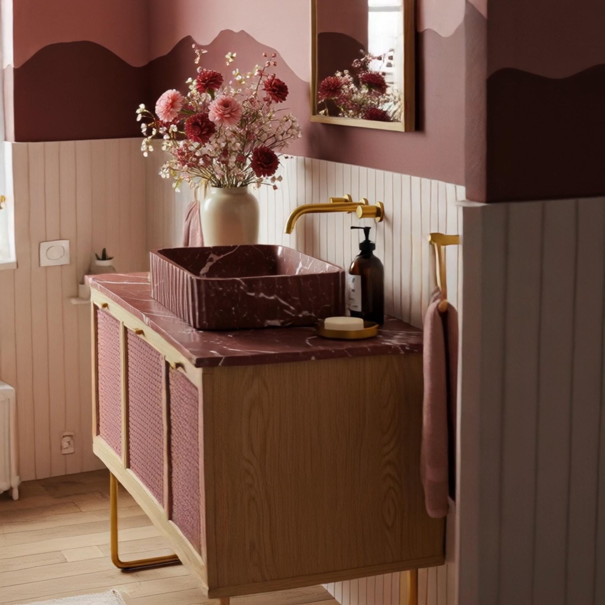 A fluted red marble sink paired with a custom wooden vanity and rattan doors, highlighting rich stone veining and artisanal details.

