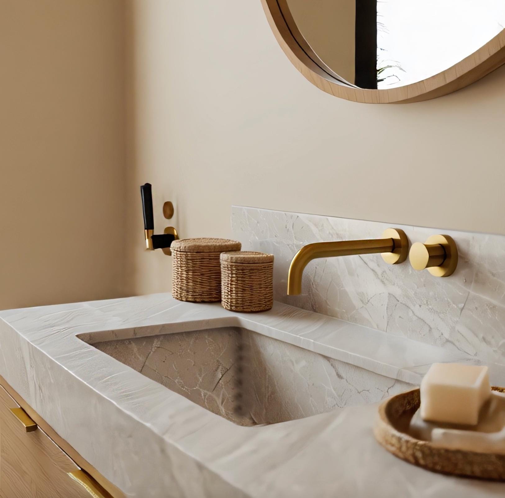 An integrated Tundra Grey marble sink set into a clean-lined oak wood vanity, highlighting subtle stone veining and warm natural textures.
