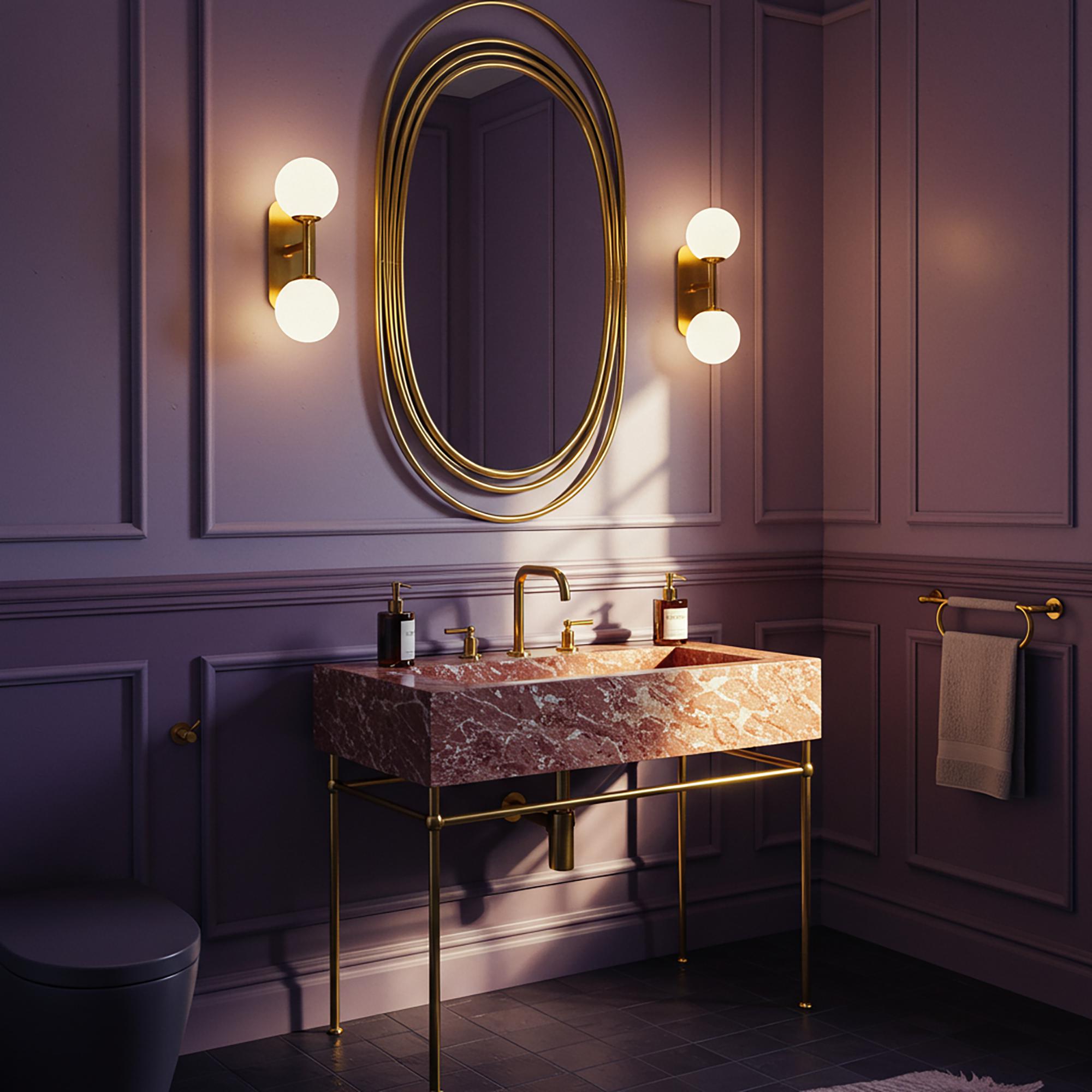 This stunning rosa marble sink features a brass structure, offering a timeless focal point for luxury bathrooms.