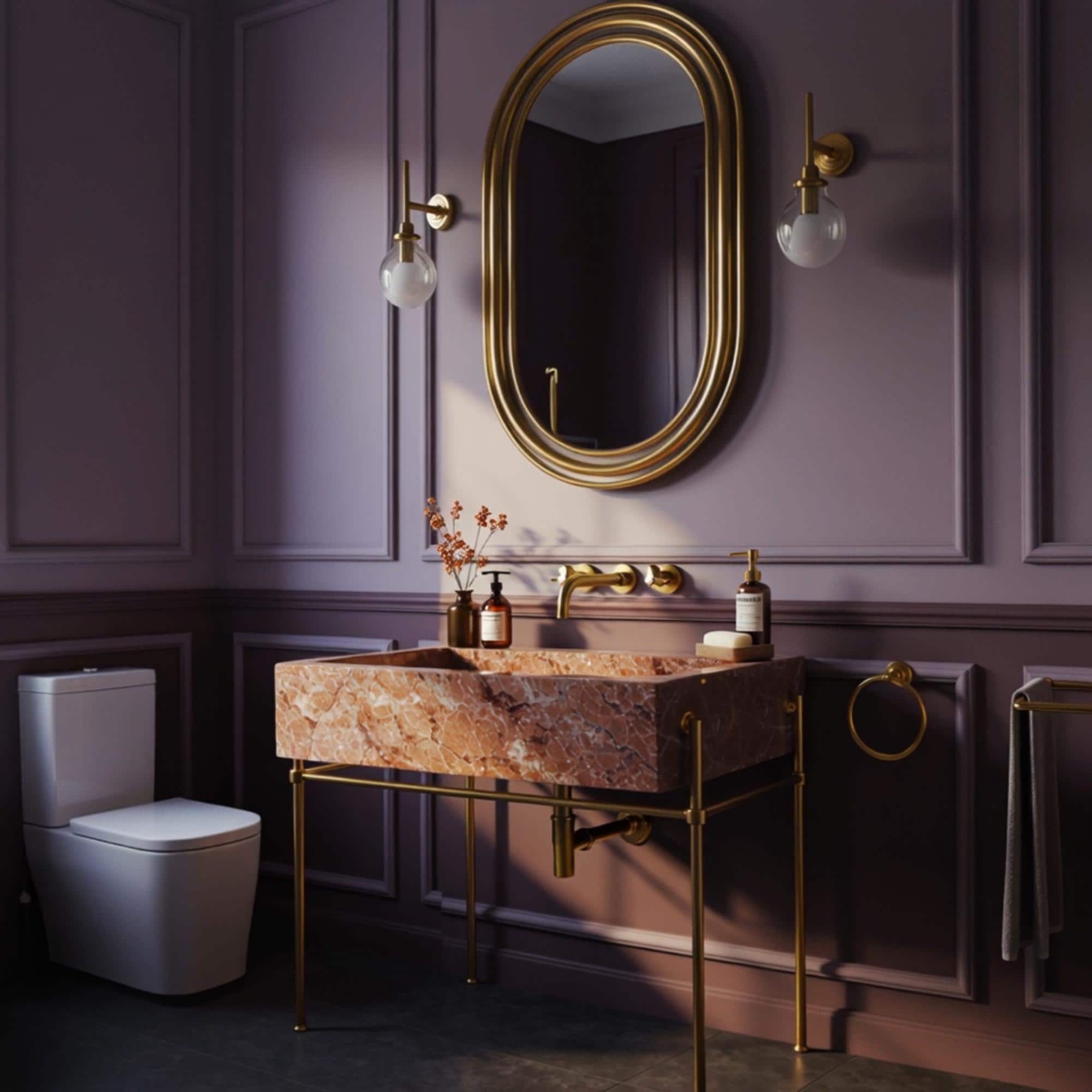 A Rosa Tea marble sink unit supported by a golden structure, bringing charm and softness to upscale spaces.