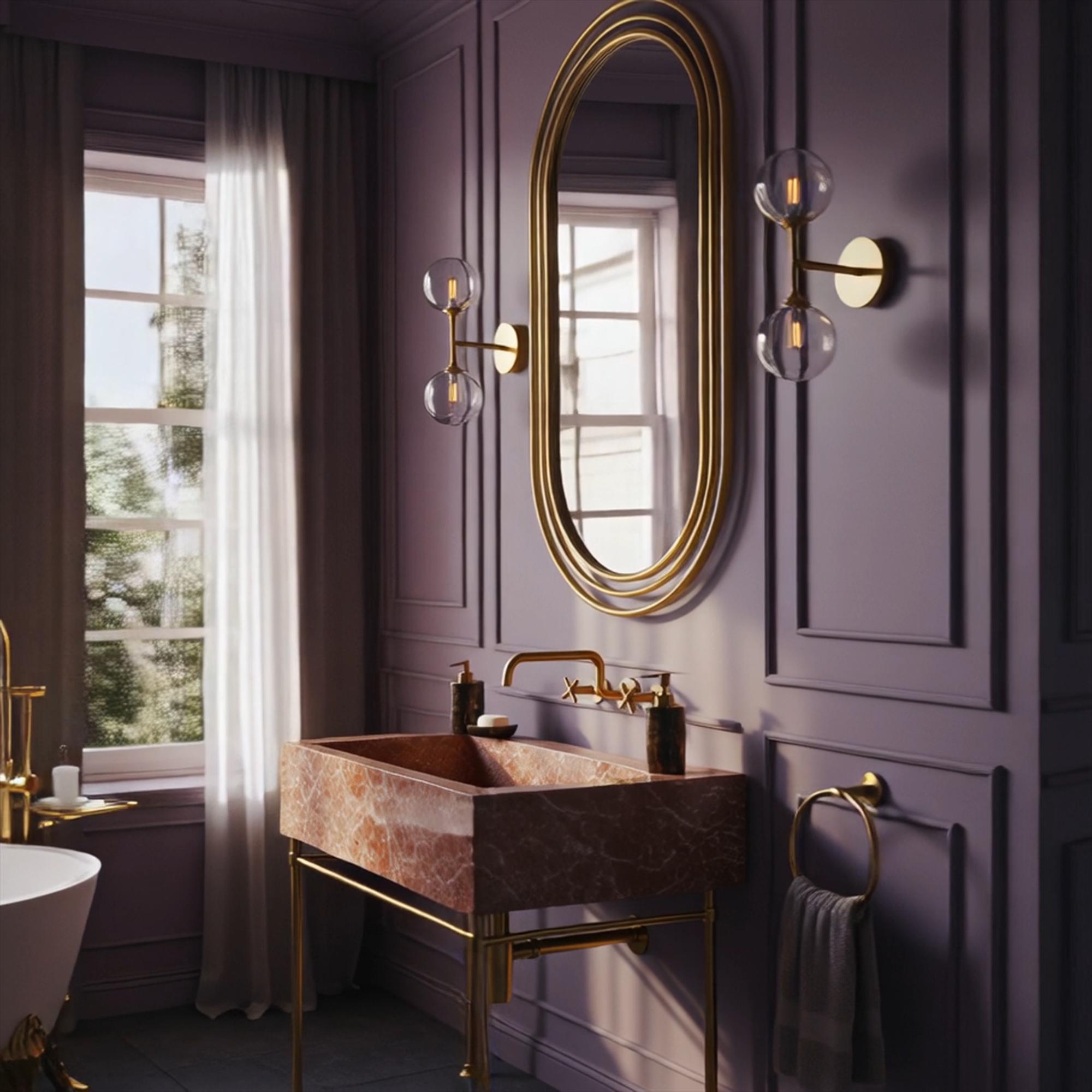 A Rosa Tea pink marble vanity with golden brass legs that adds a touch of romantic elegance to luxury interiors.