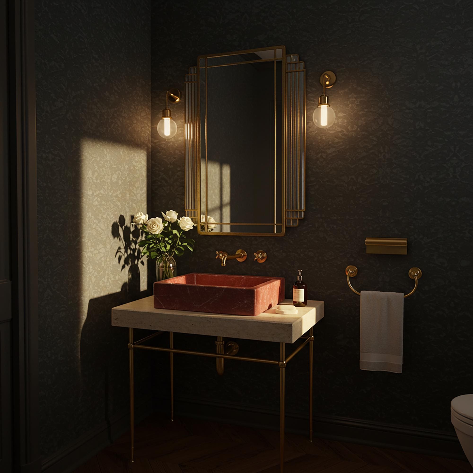 A bold Rosso Levanto marble vessel sink on a travertine console, perfect for sophisticated interiors with rich taste.