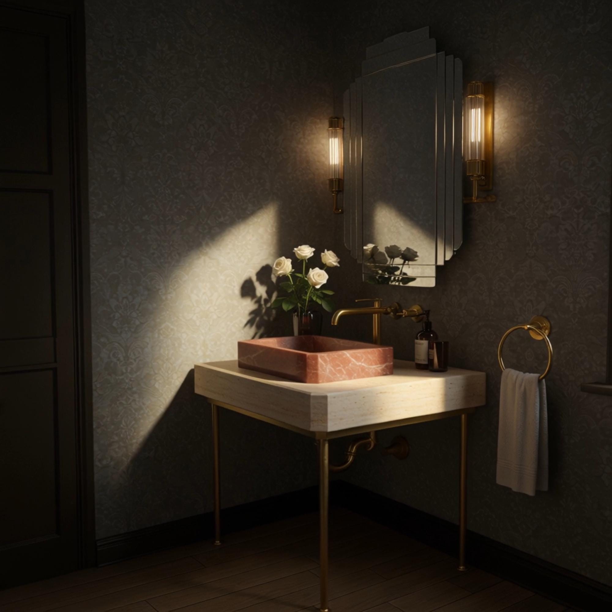 A Rosso Levanto marble vessel sink on a travertine console with brass legs, offering a timeless and elegant bathroom statement.
