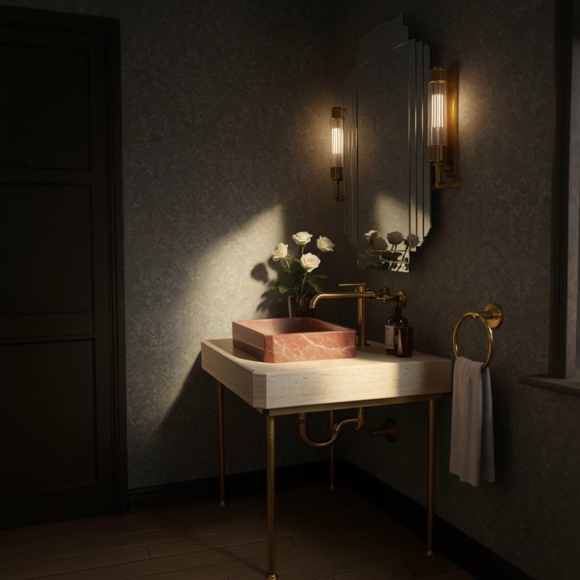 A Rosso Levanto marble vessel sink styled on a travertine console with brass detailing, adding warmth and character to a sophisticated interior.

