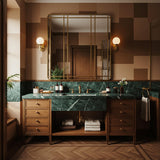 Exquisite Verde Guatemala marble estate vanity featuring deep green veining, paired with a handcrafted solid walnut cabinet and open shelving for a sophisticated master suite.
