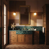 A sophisticated estate vanity combining Verde Guatemala marble and natural oak cabinetry, designed for timeless elegance.